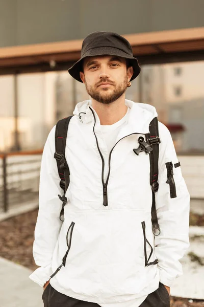 Stylish Young Man Hipster Trendy Hat White Urban Jacket Backpack — Stok fotoğraf