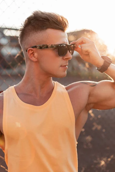 Fashionable Hipster Guy Hairstyle Puts Fashion Sunglasses Looks Sideways Sunset — Stock Photo, Image