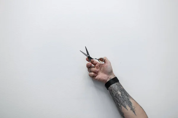 Professional Hairdresser Holds Tattooed Scissors His Hand White Background Creative — Foto de Stock