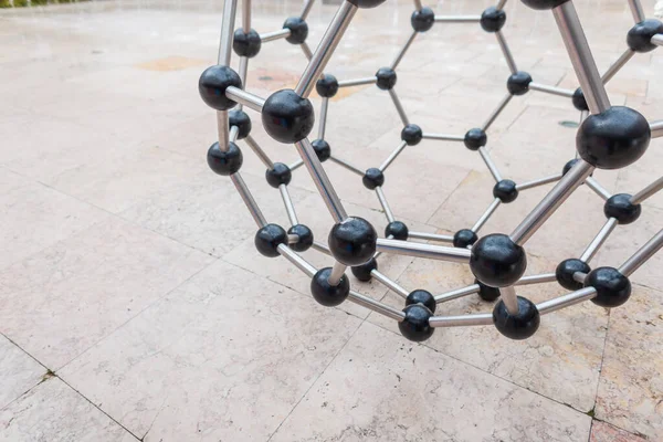 Metal art object molecule. An atom of metal. Chemistry and Science. Technology Park