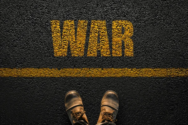 Man Before the Choice Line War. Beginning of action and strategy. World War. Man\'s boots on the pavement with a yellow line and the text War. Step towards war