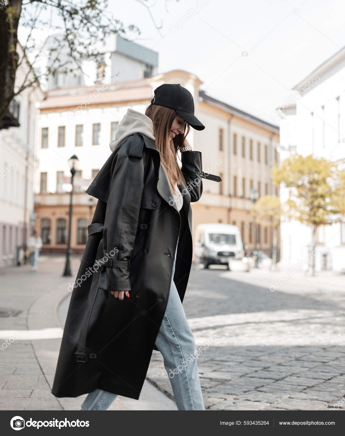 Modern Girl Wearing Casual Clothes And A Cap Posing Outdoor