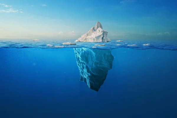 Amazing white iceberg floats in the ocean with a view underwater. Hidden Danger and Global Warming Concept. Tip of the iceberg. Half underwater. Greenland