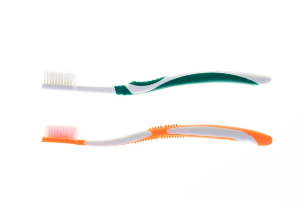 Två färg sliten tandborste på isolerade vit bakgrund — Stockfoto