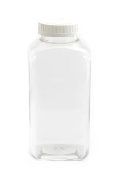Botella de plástico transparente cuadrada con cubierta blanca en la parte superior — Foto de Stock