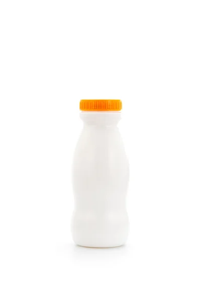 在上面的橙色封面白色塑料瓶 — 图库照片