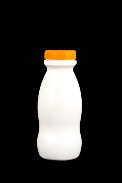 Bottiglia di plastica bianca con coperchio arancione sulla parte superiore — Foto Stock
