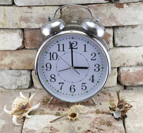 Old-fashioned clock with shells