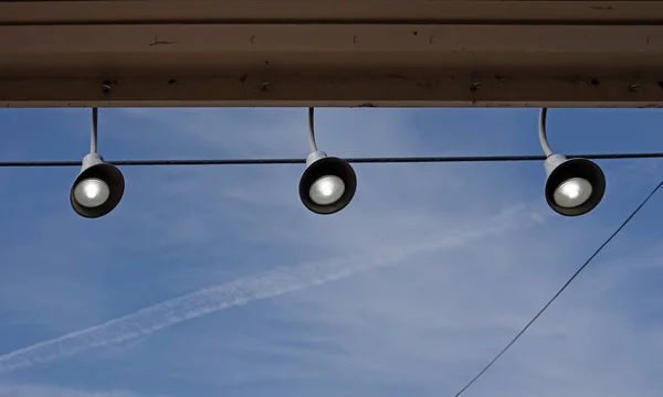 Three Illuminated Spotlights Roof Edge Blue Daylight Sky — Stock Photo, Image