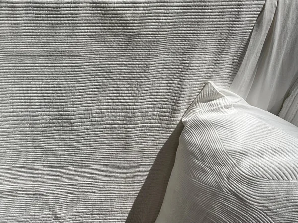 Close-up view of expensive white bedding textiles