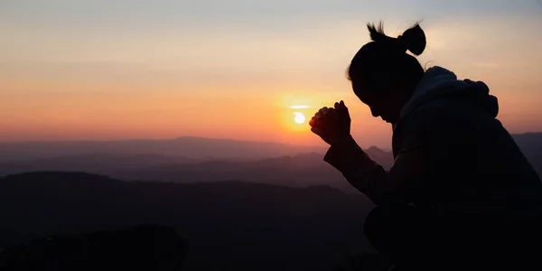 Worship and prayer banner. Silhouette of christian woman praying, spirituality and religion, woman praying to god. Christianity concept.