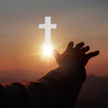 Silhouette of human hands palm up praying and worship of cross, eucharist therapy bless god helping, belief, forgiveness, freedom, hope and faith, christian religion concept on sunset background.