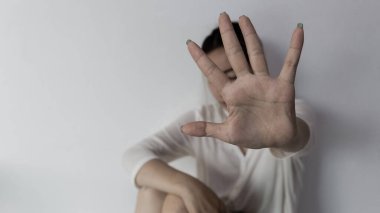 Stop hurting woman! young female person raised her hand for stop violence, sexual abuse, human trafficking, domestic violence and rape, International Day for the Elimination of Violence against Women
