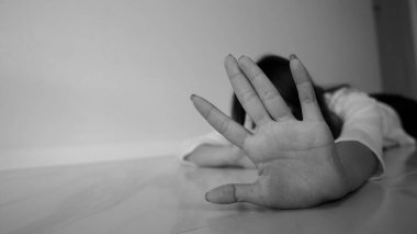 Stop hurting woman! young female person raised her hand for stop violence, sexual abuse, human trafficking, domestic violence and rape, International Day for the Elimination of Violence against Women