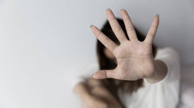 Stop hurting woman! young female person raised her hand for stop violence, sexual abuse, human trafficking, domestic violence and rape, International Day for the Elimination of Violence against Women