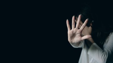 Stop hurting woman! young female person raised her hand for stop violence, sexual abuse, human trafficking, domestic violence and rape, International Day for the Elimination of Violence against Women