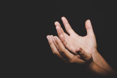 Close up Asian christian woman hands person pray and worship for thank god in church with black background, The concept for faith, spirituality and religion