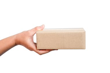 A parcel cardboard parcel box in a delivery woman person hands isolated on white background. Delivery service concept. Asian Young girl holding a package is a delivery business entrepreneur.
