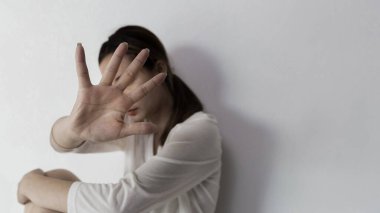 Stop hurting woman! young female person raised her hand for stop violence, sexual abuse, human trafficking, domestic violence and rape, International Day for the Elimination of Violence against Women