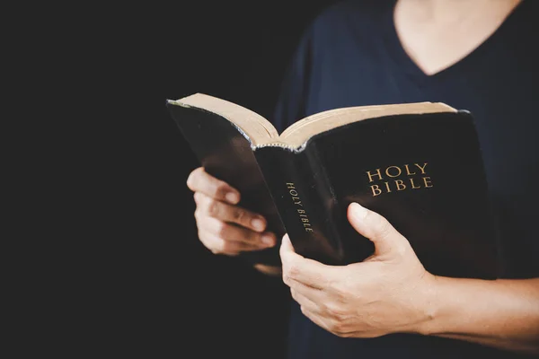 Young woman person hand holding holy bible with study at home. Adult female christian reading book in church. Girl learning religion spirituality with pray to god. concept of student education faith.