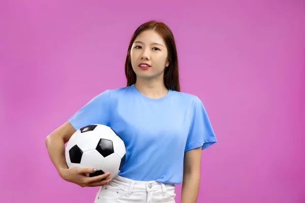 Asian Woman Blue Shirt Isolated Pink Background Holding Soccer Ball — Stok fotoğraf