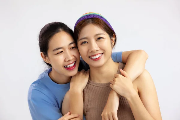 Young asian women lgbt couple isolated on white background. love and pride month concept