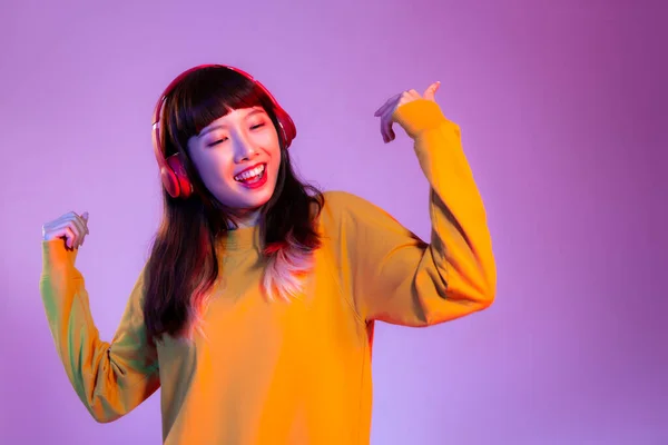 Young Asian Woman Yellow Sweatshirt Wearing Red Headphones Listen Music — Fotografia de Stock