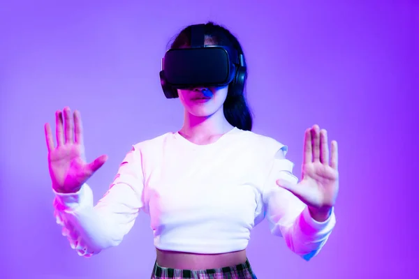 Young Asian Girl Wearing Headset Watching Playing Hands Touching Purple — Stock Fotó