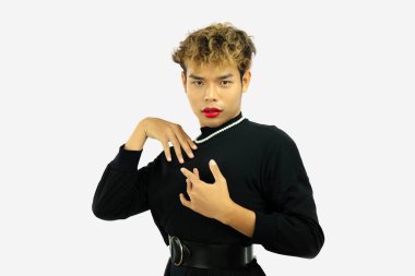 pretty asian gay posing in a black dress. Transgender isolated white color wall. LGBTQ+ concept.