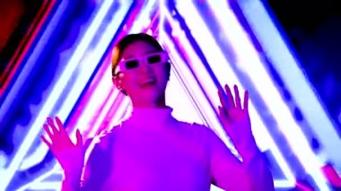 young asian woman wearing white shirt and 3d glasses dancing on motion 3d background. 4K video asian girl futuristic style, Metaverse concept