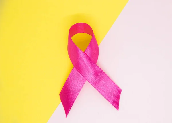 Pink Ribbon Isolated White Yellow Background Breast Cancer Awareness Symbol — Zdjęcie stockowe