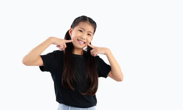 Asian Cute Girl Black Shirt Posing Finger Pointing Cheek Smiling – stockfoto