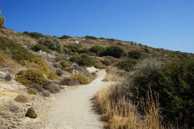 Beautiful mountain landscape with drought-resistant vegetation at Theotokos hill in Kolimpia, Rhodes, Greece 