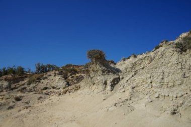 Beautiful mountain landscape with drought-resistant vegetation at Theotokos hill in Kolimpia, Rhodes, Greece 