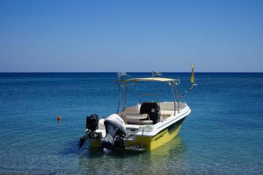 Boat on the water off the coast of Kolimpia, Rhodes, Greece 