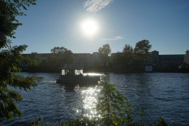 View of the sunset over the river Dahme from the island of Schlossinsel. 12557 Berlin, Germany 