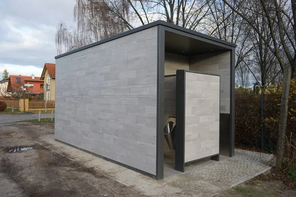 Berlin architecture. Modern outdoor toilet near the recreation area. Kaulsdorf, Berlin, Germany