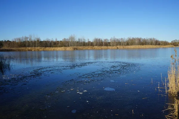 Ice on the Habermannsee lake in December. Kaulsdorfer Baggersee, Marzahn-Hellersdorf, Berlin, Germany