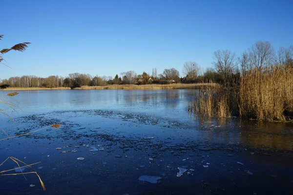 Ice on the Habermannsee lake in December. Kaulsdorfer Baggersee, Marzahn-Hellersdorf, Berlin, Germany