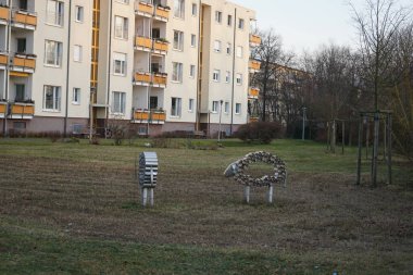 Decorative aluminum sheep on a meadow in the recreation area of Berliners in December. Berlin, Germany