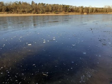 Ice on the Habermannsee lake in December. Kaulsdorfer Baggersee, Marzahn-Hellersdorf, Berlin, Germany