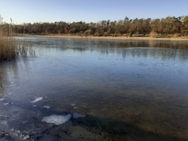Ice on the Habermannsee lake in December. Kaulsdorfer Baggersee, Marzahn-Hellersdorf, Berlin, Germany