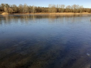 Ice on the Habermannsee lake in December. Kaulsdorfer Baggersee, Marzahn-Hellersdorf, Berlin, Germany 