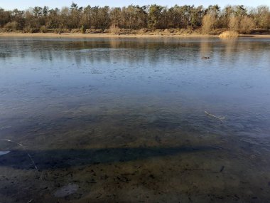 Ice on the Habermannsee lake in December. Kaulsdorfer Baggersee, Marzahn-Hellersdorf, Berlin, Germany 