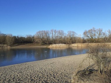 Ice on the Habermannsee lake in December. Kaulsdorfer Baggersee, Marzahn-Hellersdorf, Berlin, Germany 
