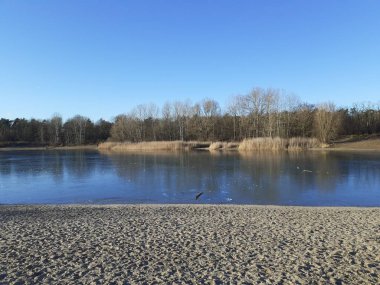 Ice on the Habermannsee lake in December. Kaulsdorfer Baggersee, Marzahn-Hellersdorf, Berlin, Germany