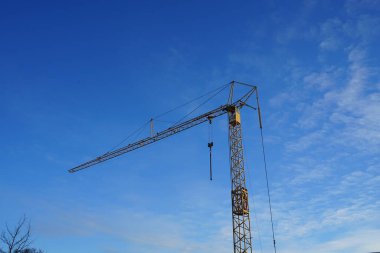 A crane against the sky at a construction site. Berlin, Germany