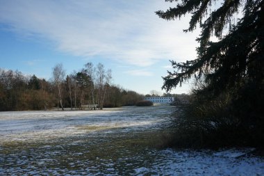 Beautiful snowy nature landscape in Innovationspark Wuhlheide in January. Berlin, Germany