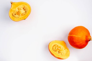 Hokkaido pumpkins on white background. Top view, flat lay, copy space.