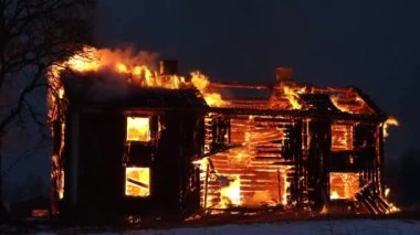 Burning house. Old wood house is burning. Fire